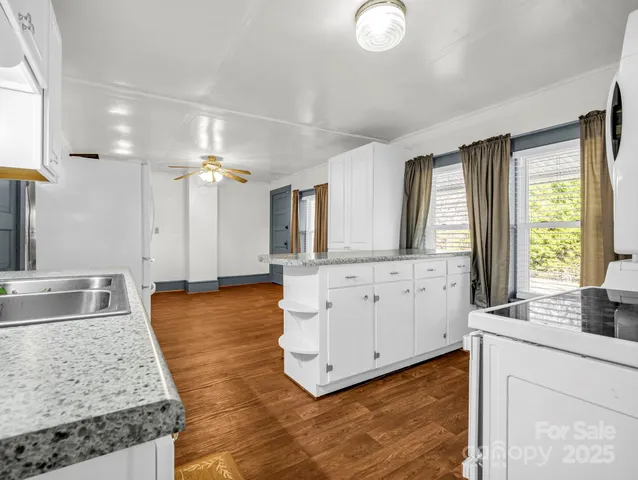 a view of living room with granite countertop furniture and fireplace