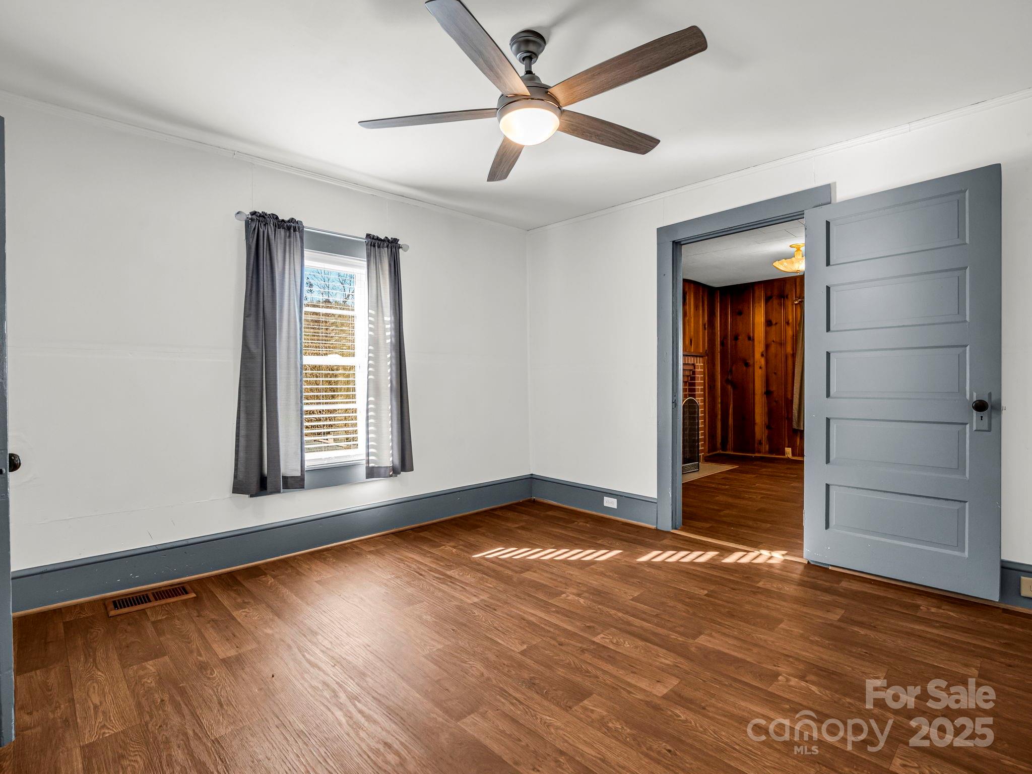 620 Smith Waldrop Road Columbus, NC 28722 - Photo 8 of 42 an empty room with wooden floor closet and windows