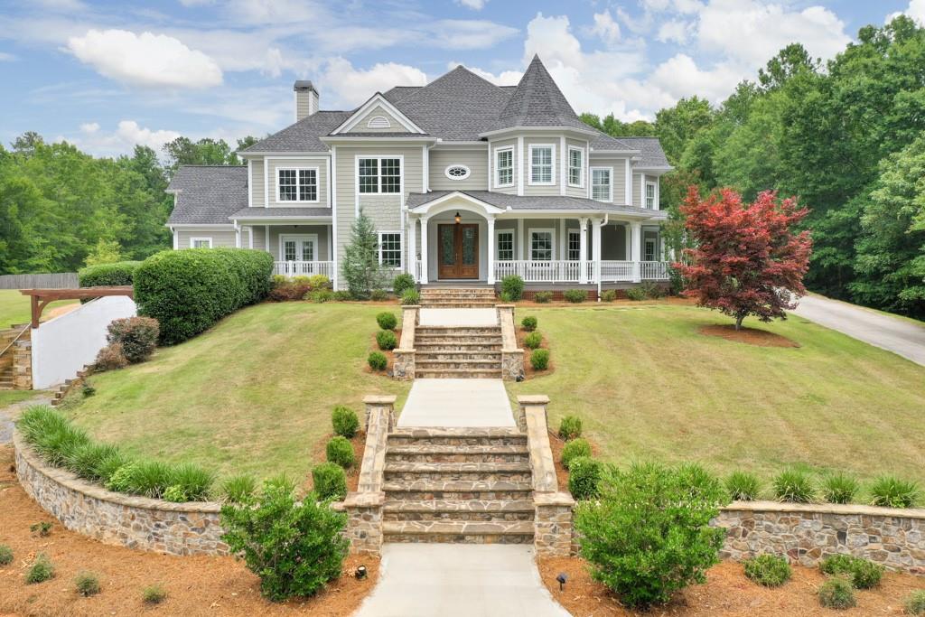 1187 Austin Bridge Road Douglasville, GA 30134 - Photo 1 of 1 a front view of a house with a yard