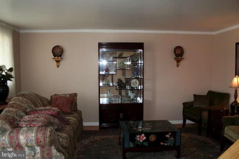 7811 Harold Road Dundalk, MD 21222 - Photo 3 of 10 a living room with furniture and a window