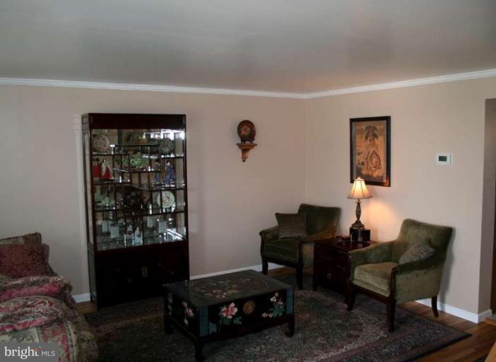 7811 Harold Road Dundalk, MD 21222 - Photo 7 of 10 a living room with furniture and a window