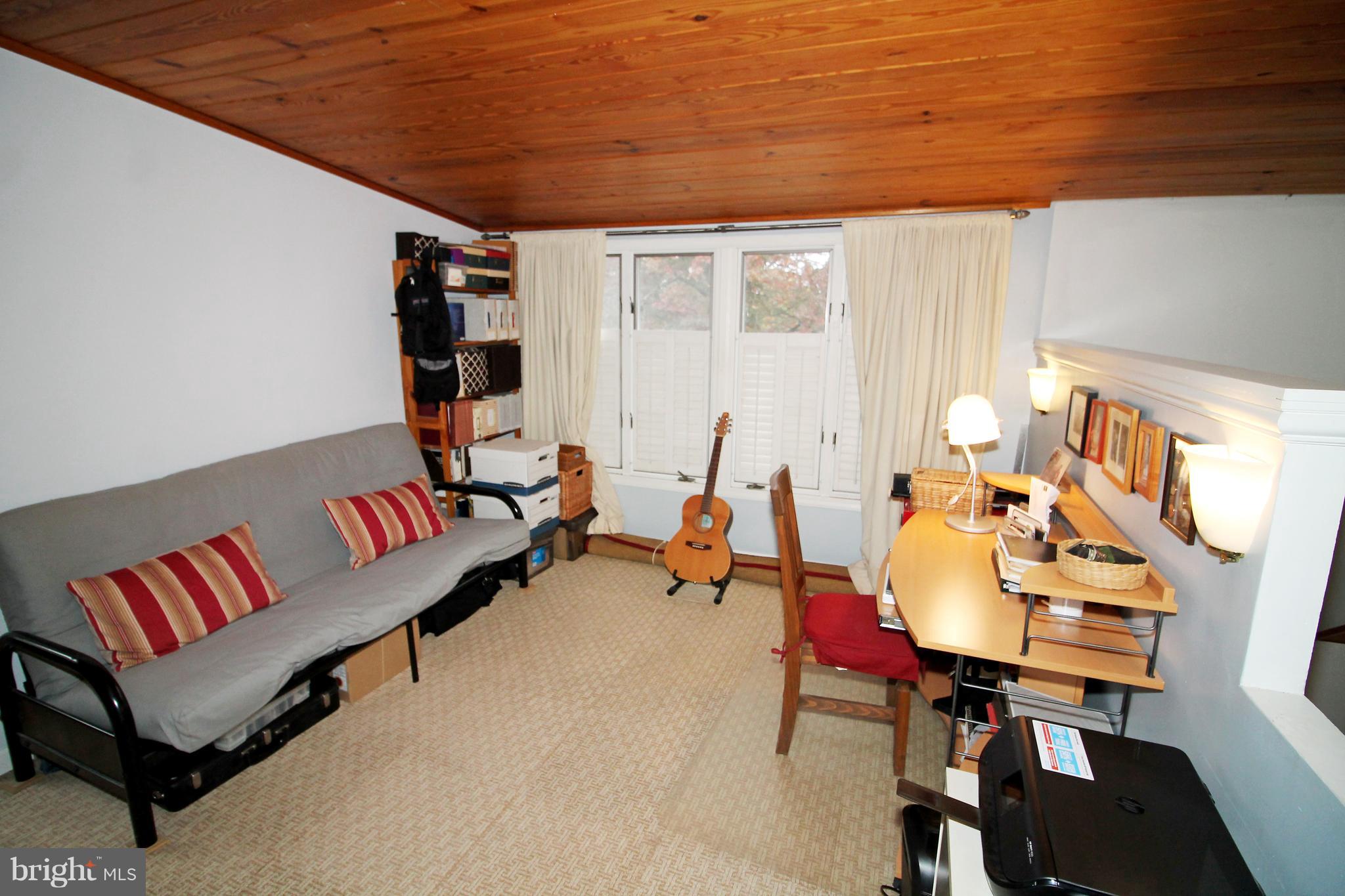 2707 Goodwood Road Baltimore, MD 21214 - Photo 22 of 31 a living room with furniture and a flat screen tv