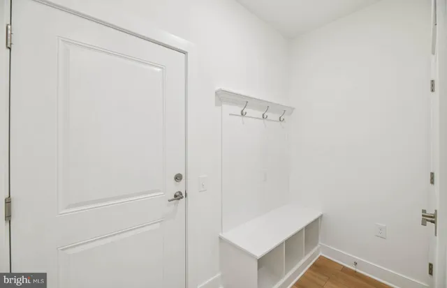 a view of room with wooden floor