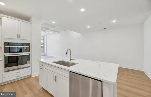 a kitchen with a sink and cabinets