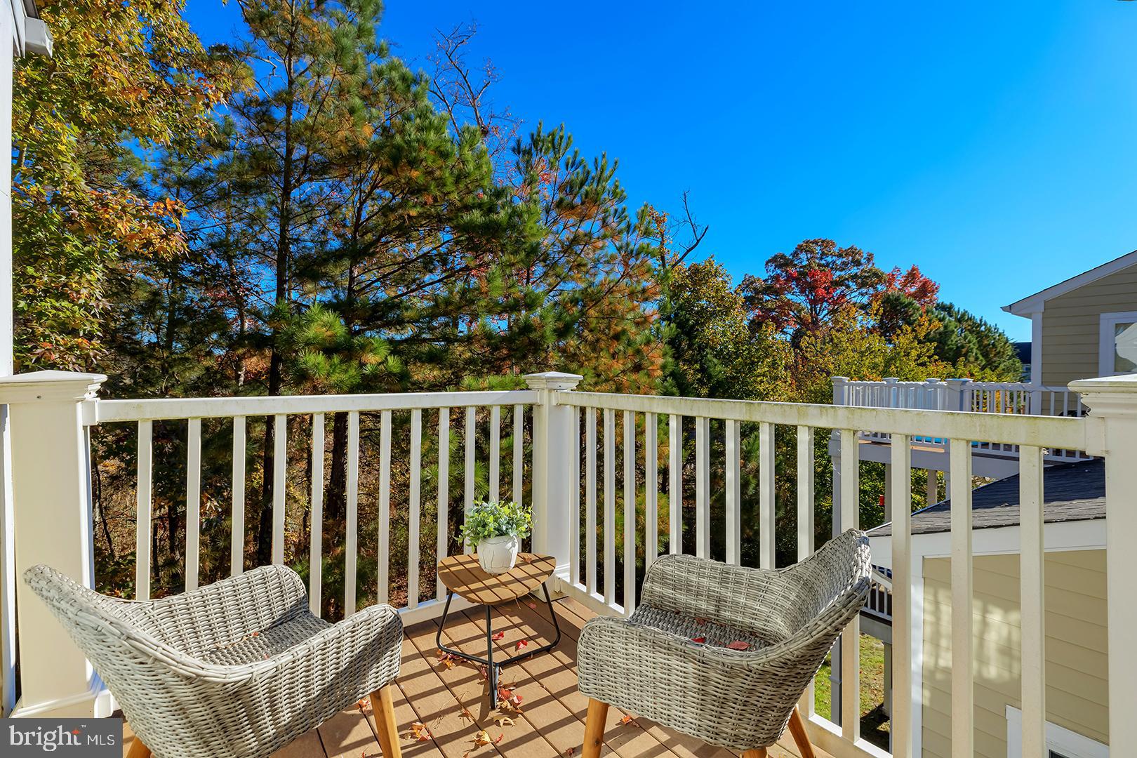 26 Dockside Drive Millville, DE 19967 - Photo 43 of 83 a view of a chair in wooden deck