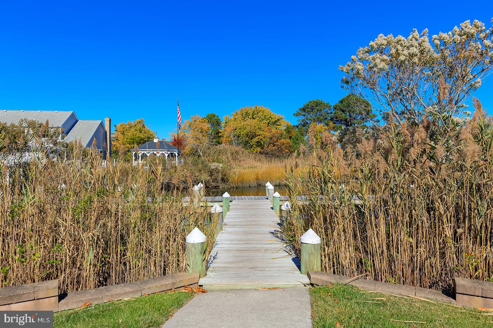 26 Dockside Drive Millville, DE 19967 - Photo 65 of 83 a view of a pathway with a building in the background