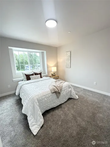 a bedroom with a bed and furniture