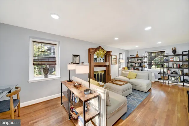 a living room with furniture or wooden floor and a window