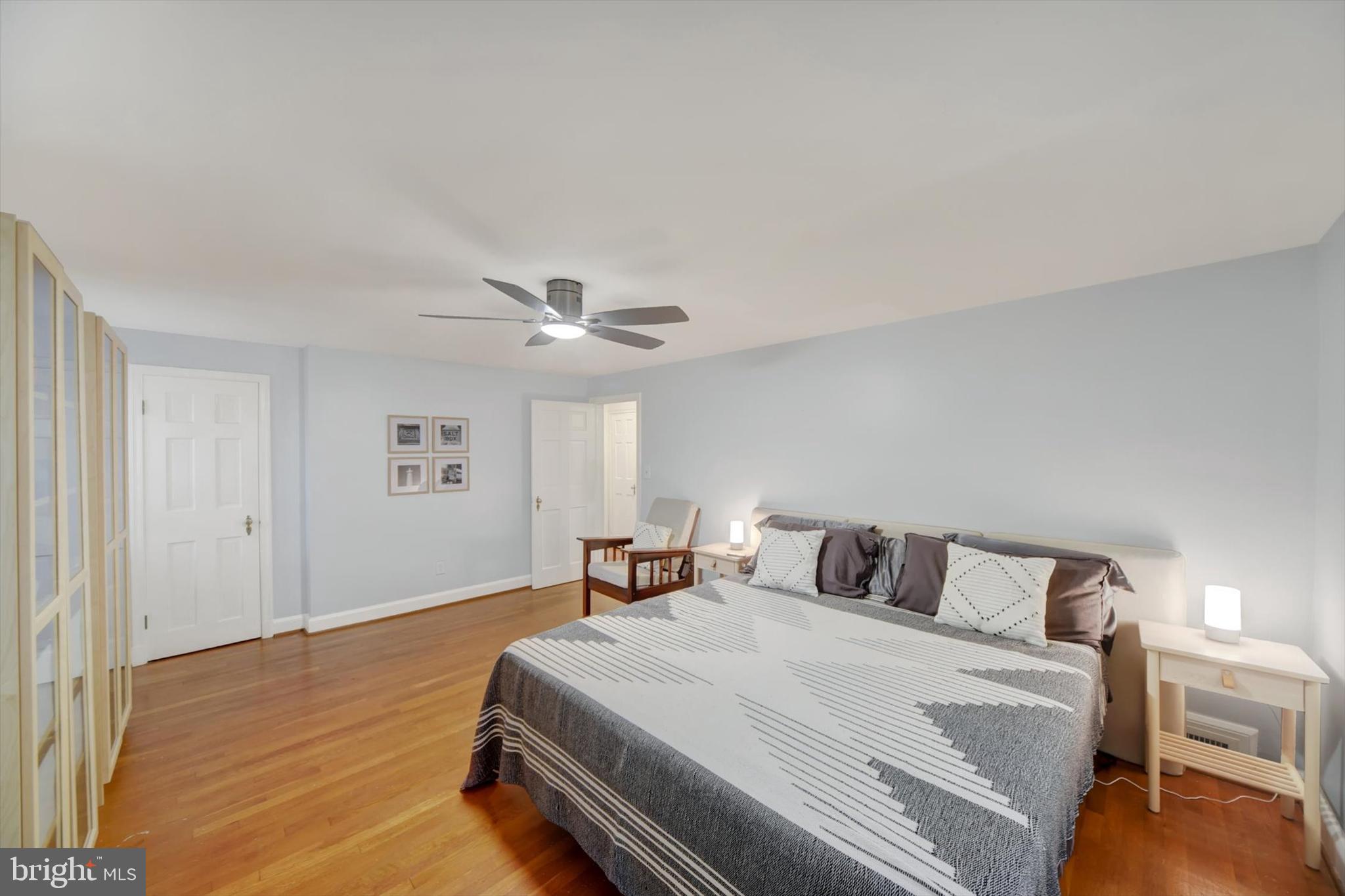 1219 Southview Road Baltimore, MD 21218 - Photo 28 of 39 a bedroom with a bed and wooden floor