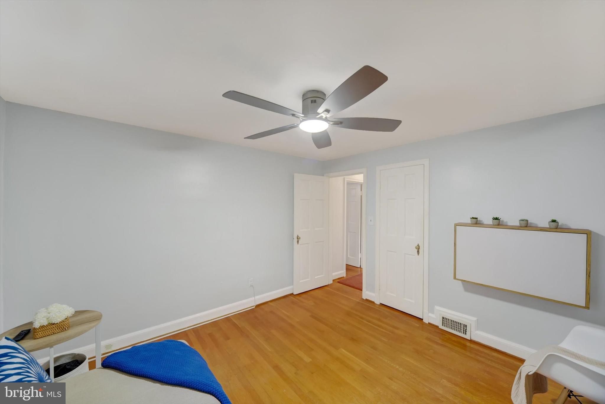1219 Southview Road Baltimore, MD 21218 - Photo 31 of 39 a bedroom with a bed and a ceiling fan