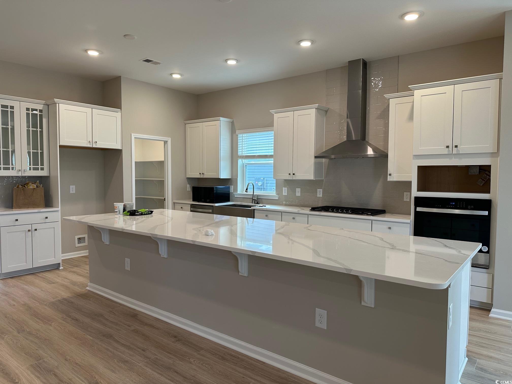5223 Lucy Way Myrtle Beach, SC 29579 - Photo 4 of 27 Kitchen featuring black appliances, white cabinets