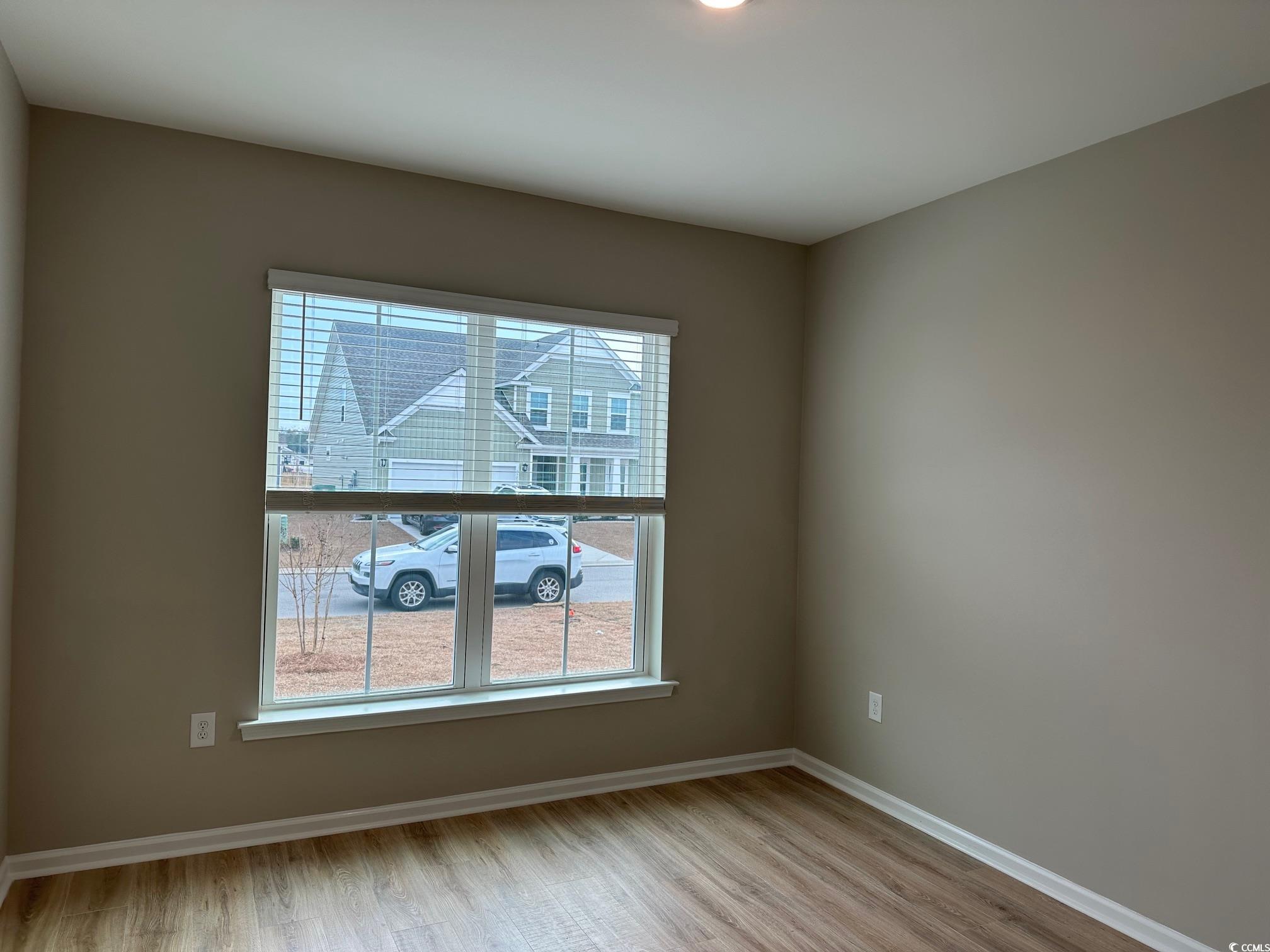 5223 Lucy Way Myrtle Beach, SC 29579 - Photo 9 of 27 Spare room with light wood-type flooring and a wea
