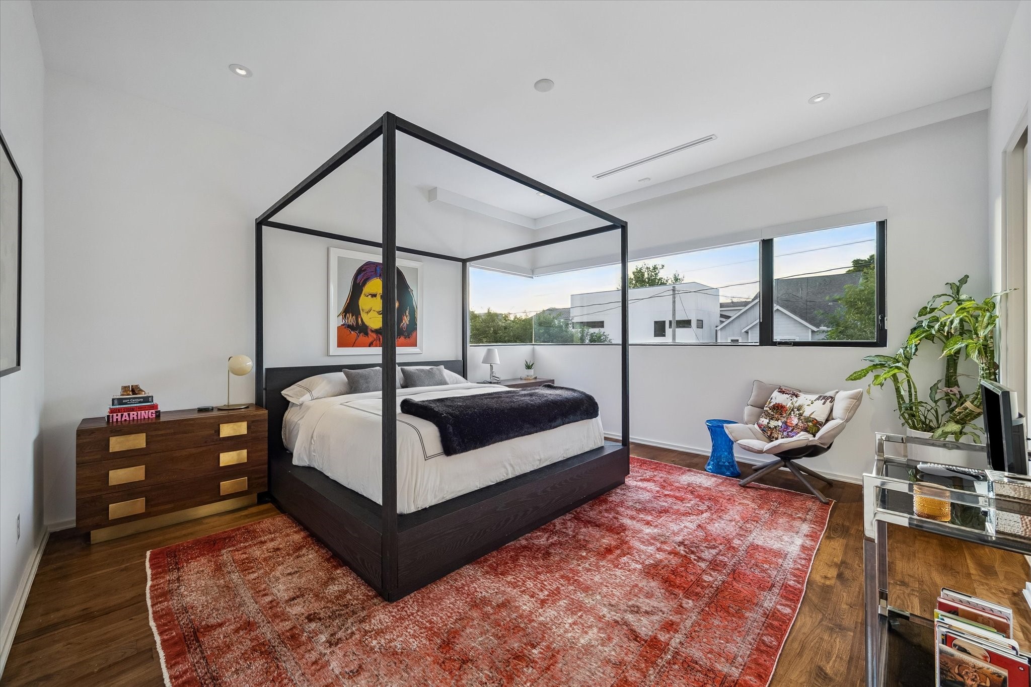 1527 Indiana Street Houston, TX 77006 - Photo 22 of 30 Secondary bedrooms - feature rich European wood flooring, soaring ceilings, recessed lighting, and windows that frame views of a majestic oak canopy.