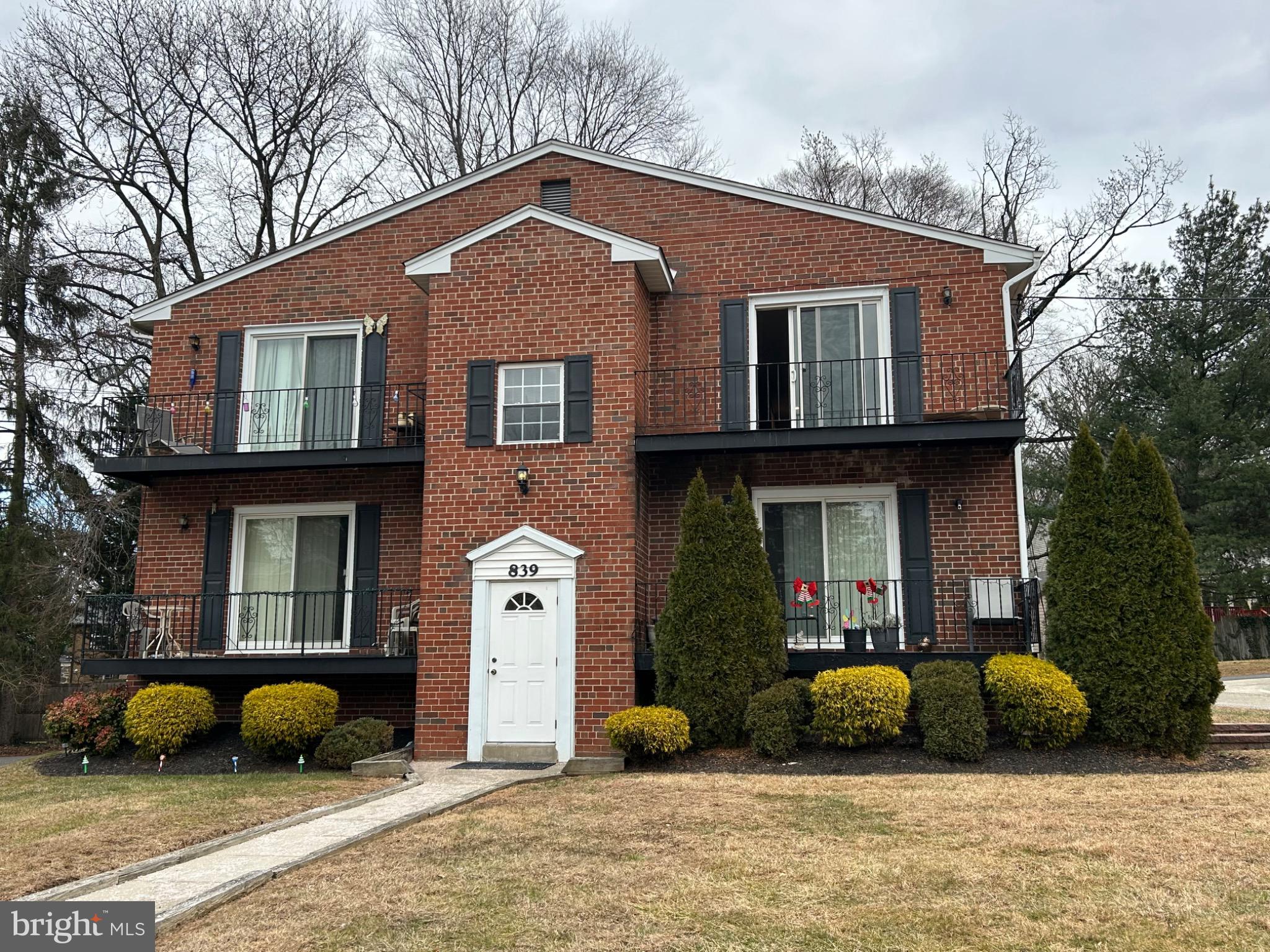 839 Garrett Road Springfield, PA 19064 - Photo 2 of 20 a front view of a house with a yard and glass windows