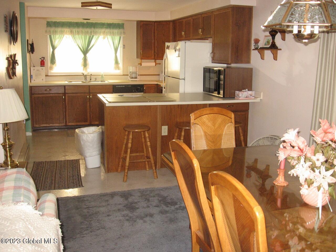 66 Freebern Road, Unit 66H Johnsburg, NY 12853 - Photo 4 of 7 66-H kitchen & dining room (1280x960)
