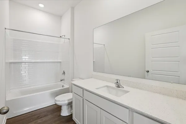 a bathroom with a sink a toilet and a bathtub