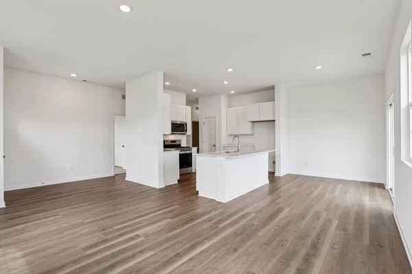 a view of kitchen with wooden floor