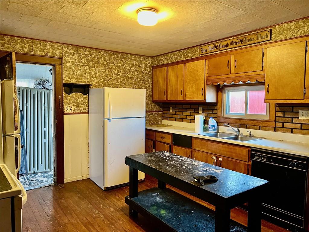 202 Fuller Street Somerset, PA 15501 - Photo 7 of 20 a kitchen with stainless steel appliances granite countertop a refrigerator and a stove top oven