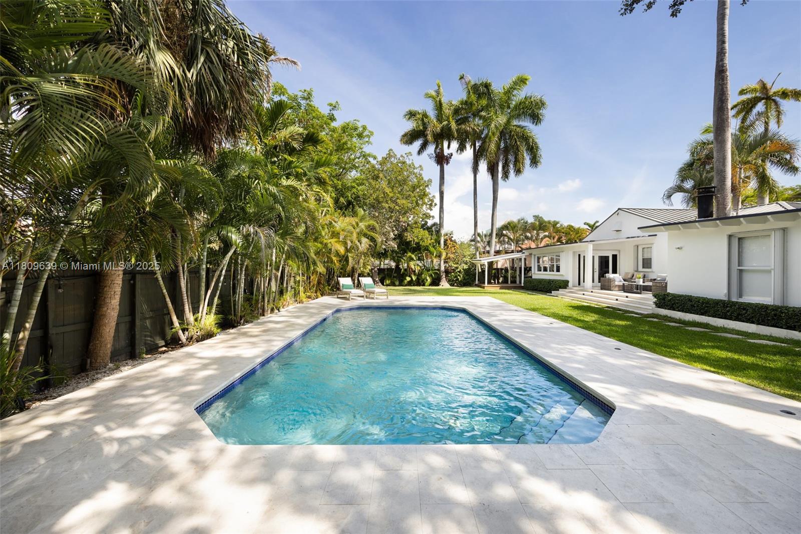 148 Southwest 22nd Road Miami, FL 33129 - Photo 25 of 29 a view of a swimming pool with a yard