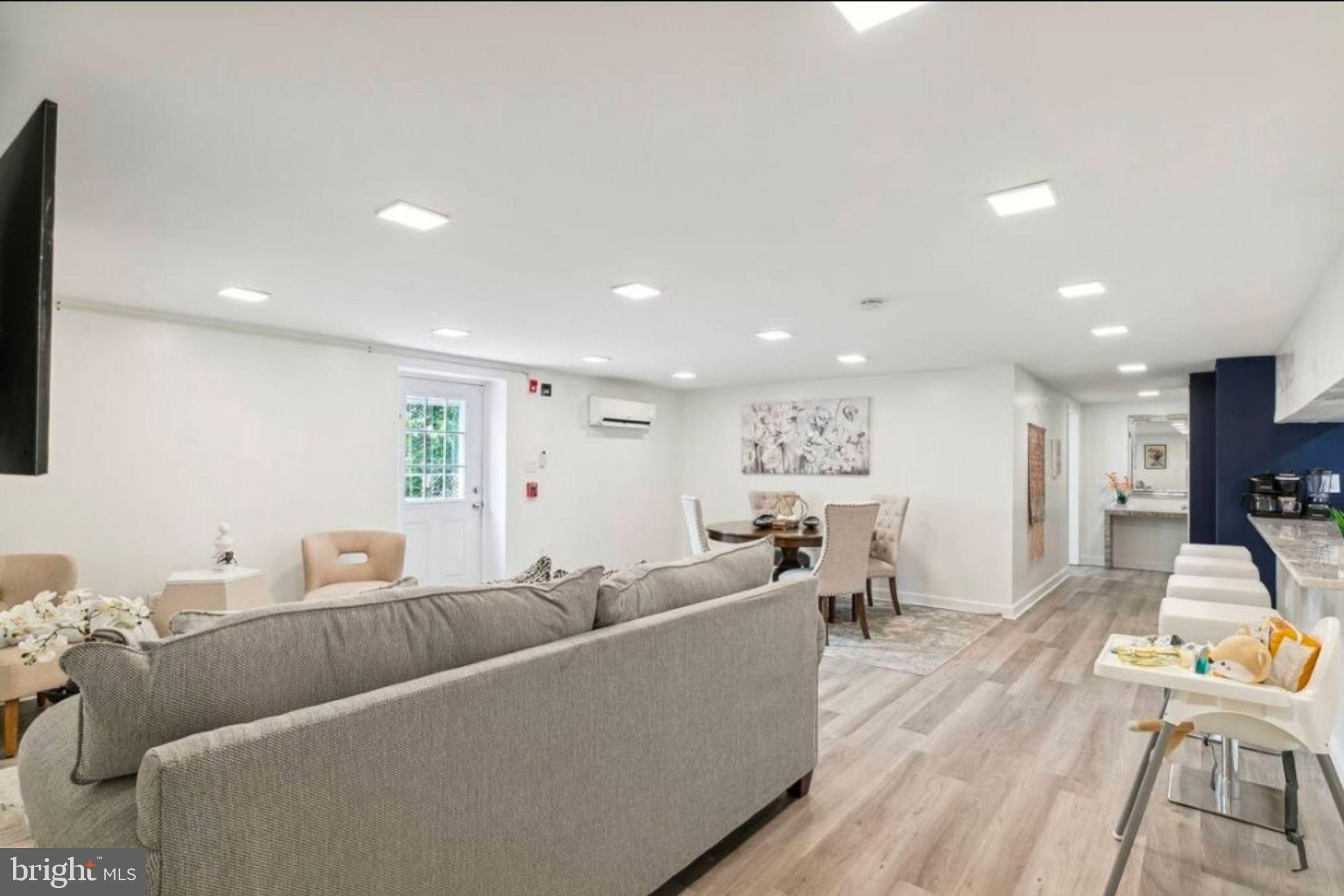 311 Old Rodgers Road Bristol, PA 19007 - Photo 6 of 9 a living room with furniture and a wooden floor