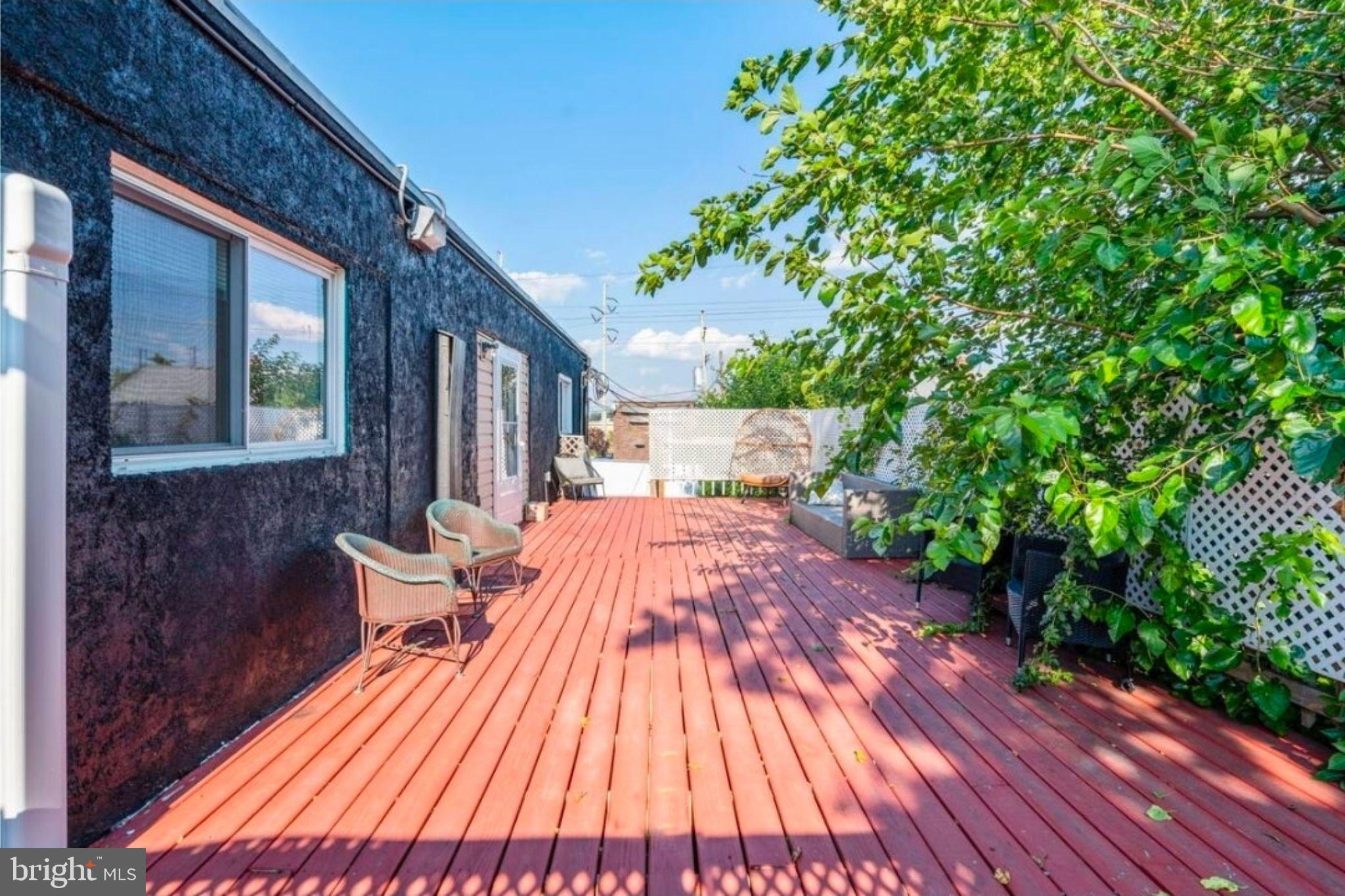 311 Old Rodgers Road Bristol, PA 19007 - Photo 9 of 9 a view of backyard with a deck and wooden floor