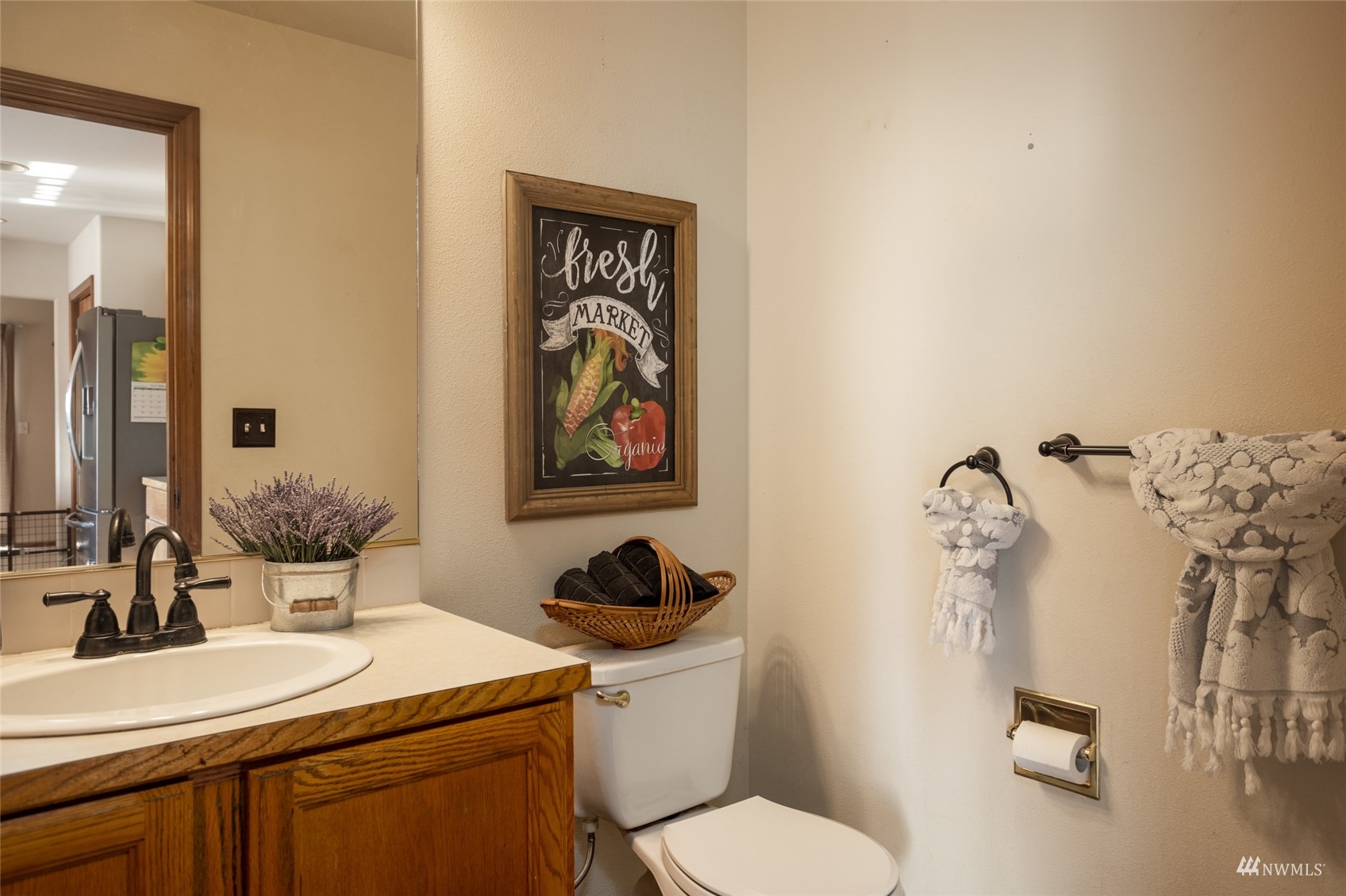 15606 Beaver Marsh Road Mount Vernon, WA 98273 - Photo 16 of 39 a bathroom with a toilet a sink and mirror