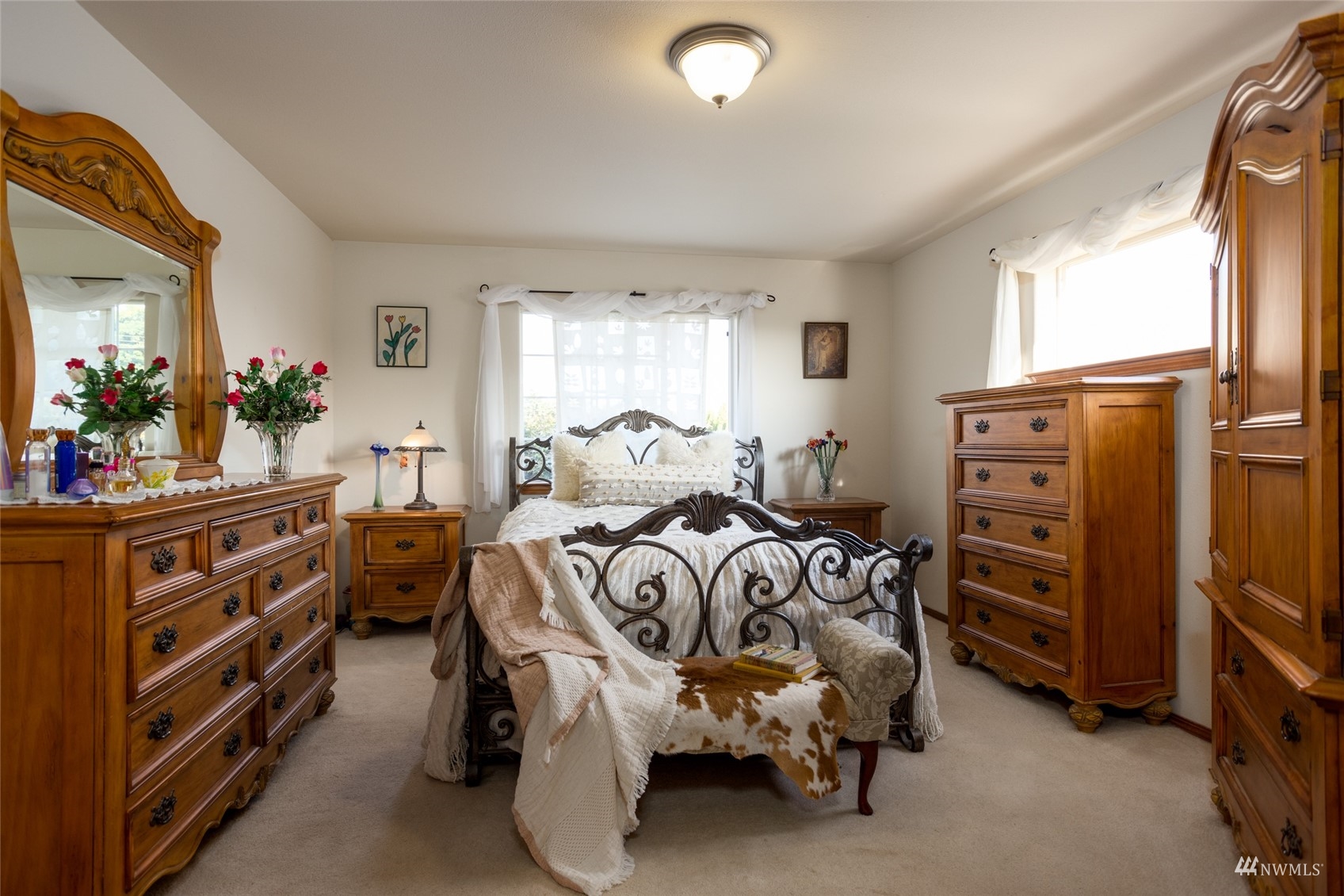 15606 Beaver Marsh Road Mount Vernon, WA 98273 - Photo 18 of 39 a bedroom with a bed and a dresser
