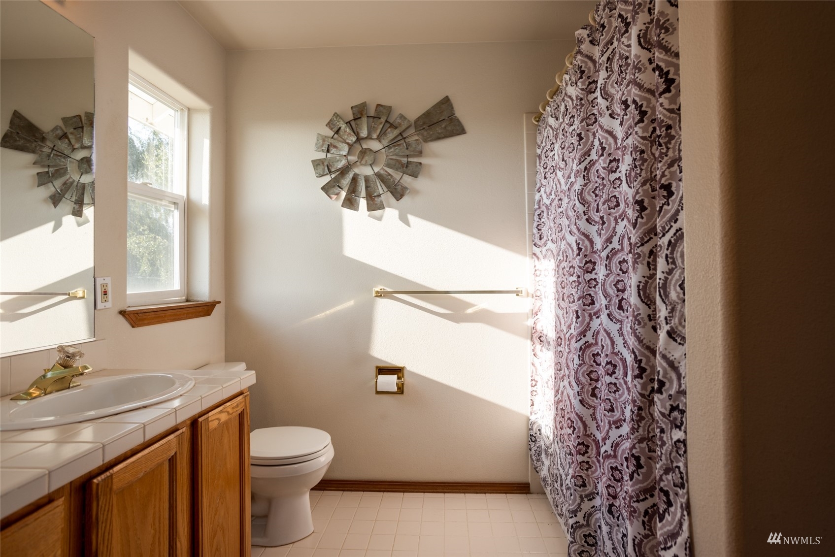 15606 Beaver Marsh Road Mount Vernon, WA 98273 - Photo 20 of 39 a bathroom with a sink toilet and window