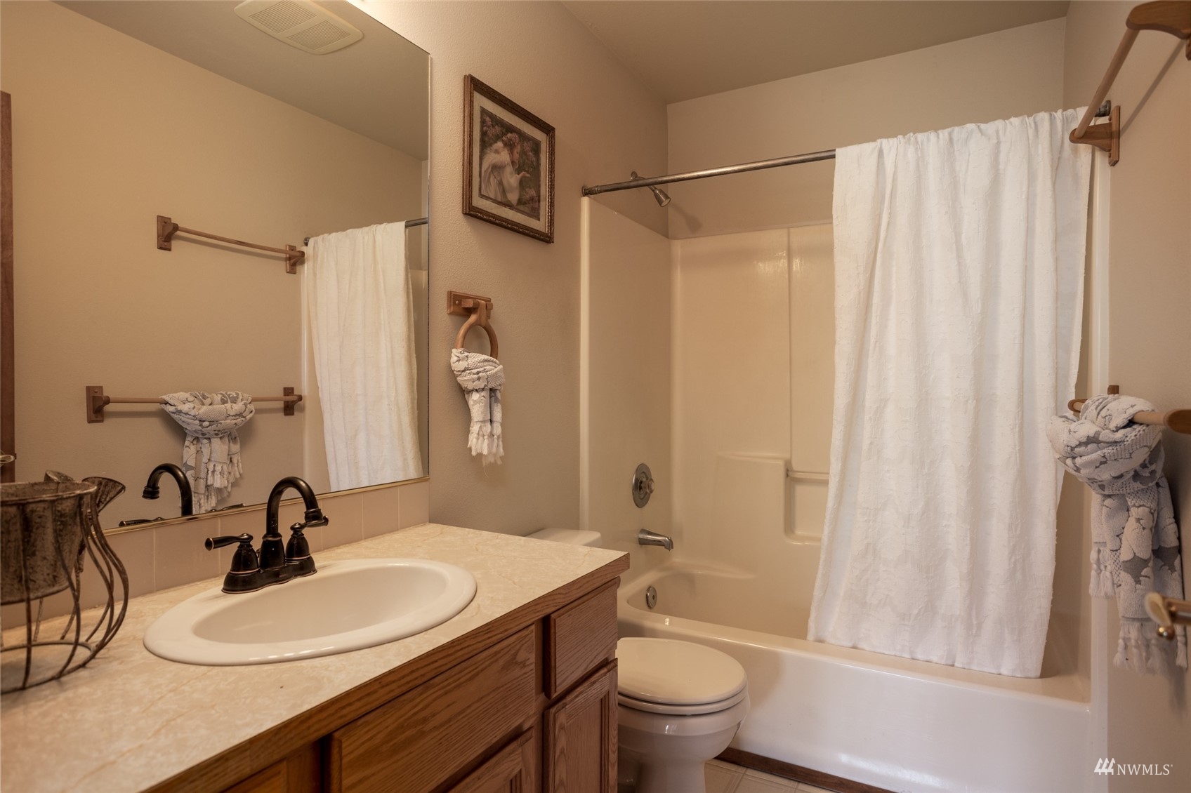 15606 Beaver Marsh Road Mount Vernon, WA 98273 - Photo 22 of 39 a bathroom with a sink a toilet and a mirror