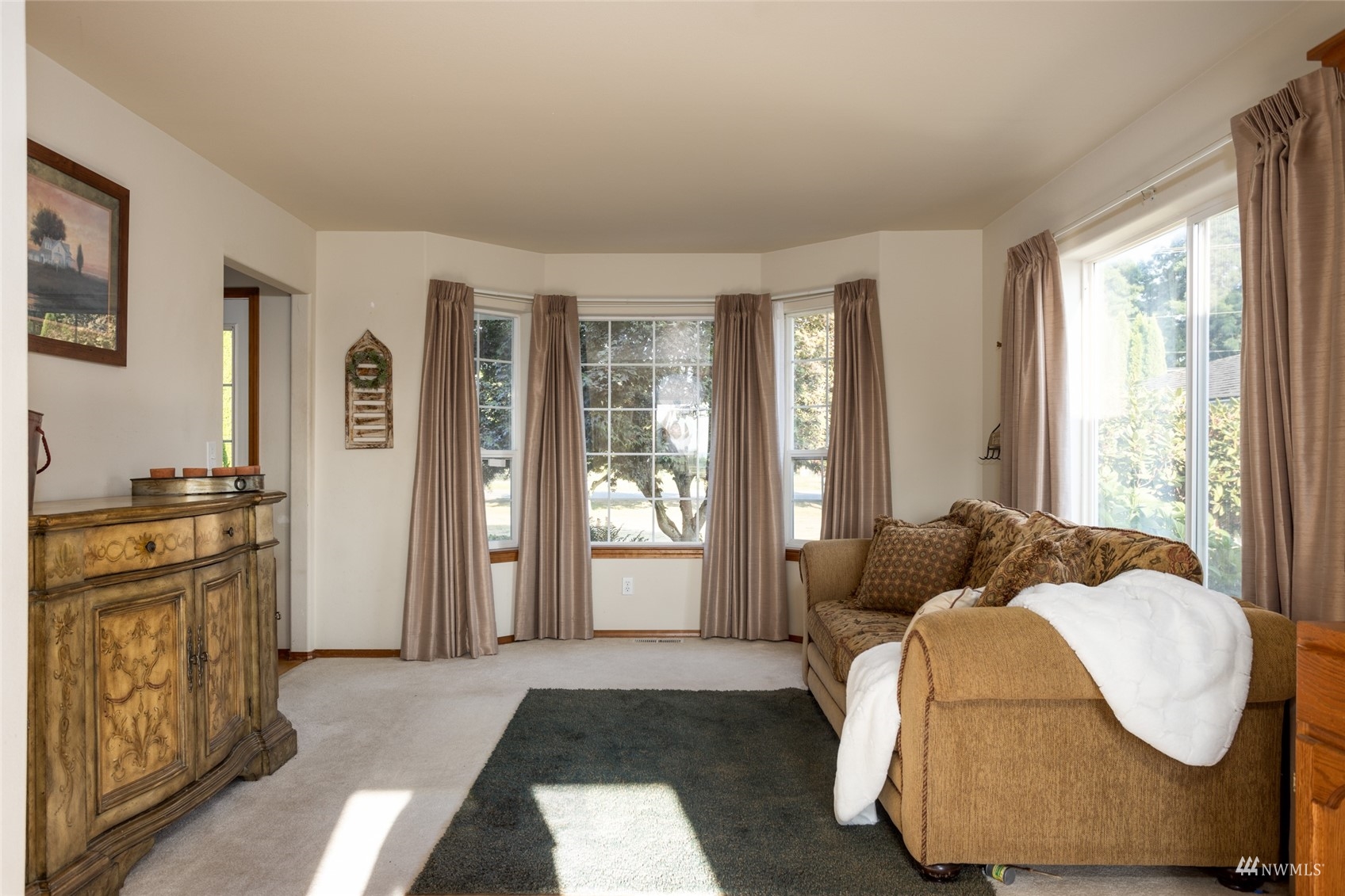 15606 Beaver Marsh Road Mount Vernon, WA 98273 - Photo 7 of 39 a bedroom with a bed and wooden floor