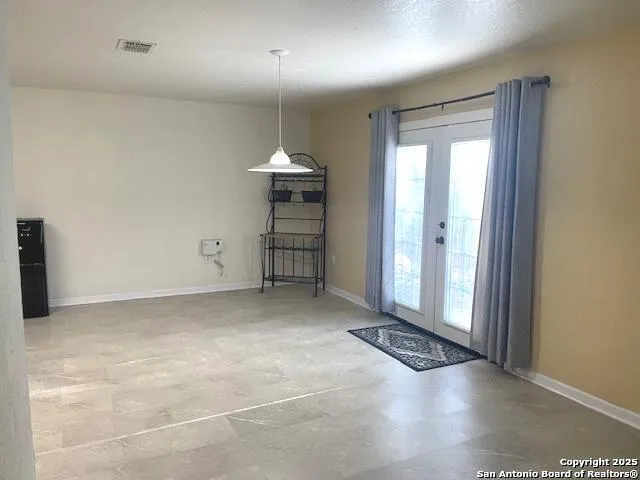 an empty room with wooden floor