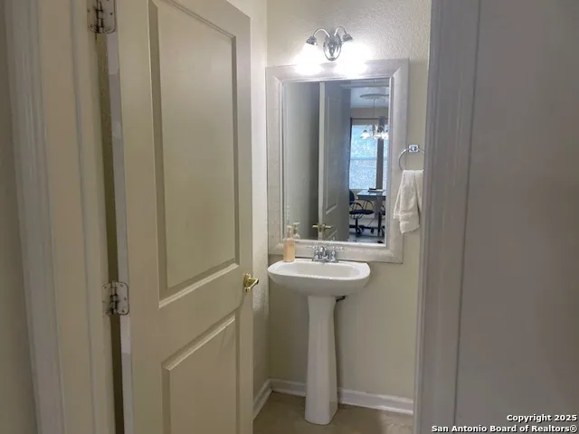 a bathroom with a sink and mirror