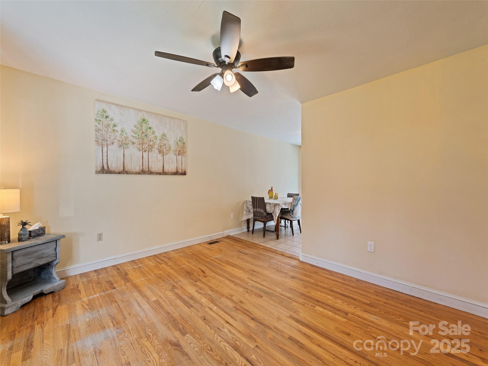 140 Oakdale Road Waynesville, NC 28786 - Photo 11 of 30 a view of room with window and wooden floor