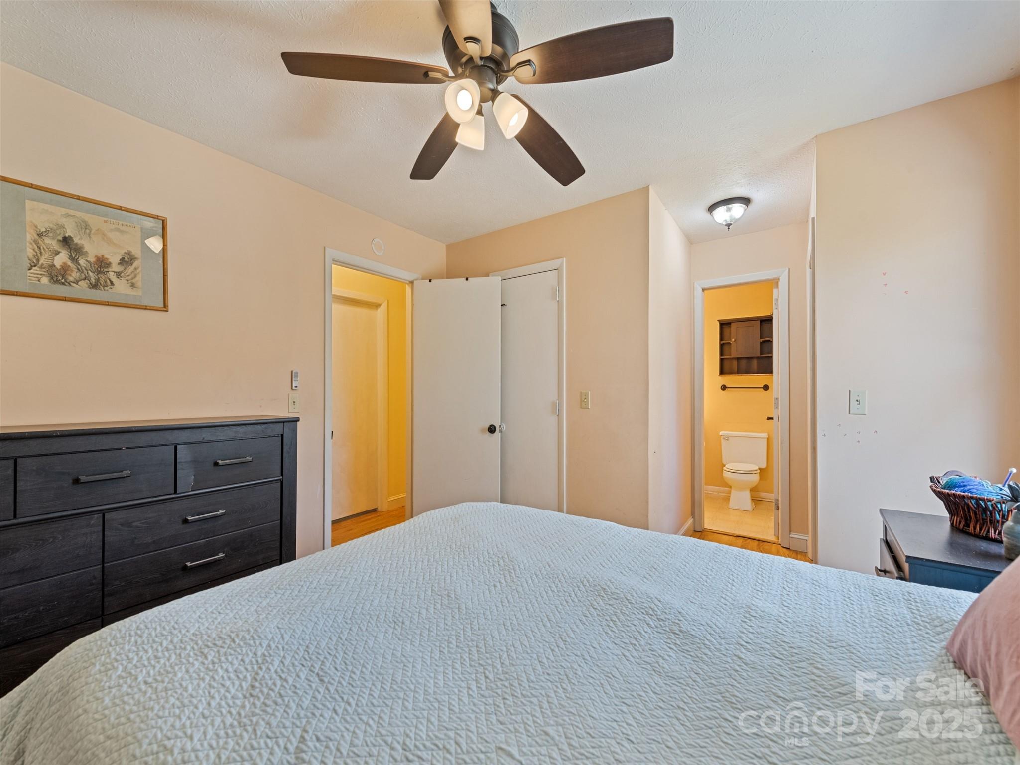 140 Oakdale Road Waynesville, NC 28786 - Photo 18 of 30 a bedroom with a bed and a dresser