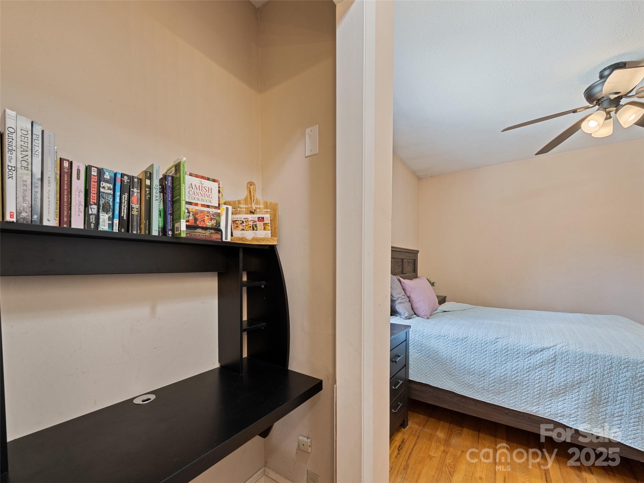 140 Oakdale Road Waynesville, NC 28786 - Photo 19 of 30 a bedroom with a bed and cabinet