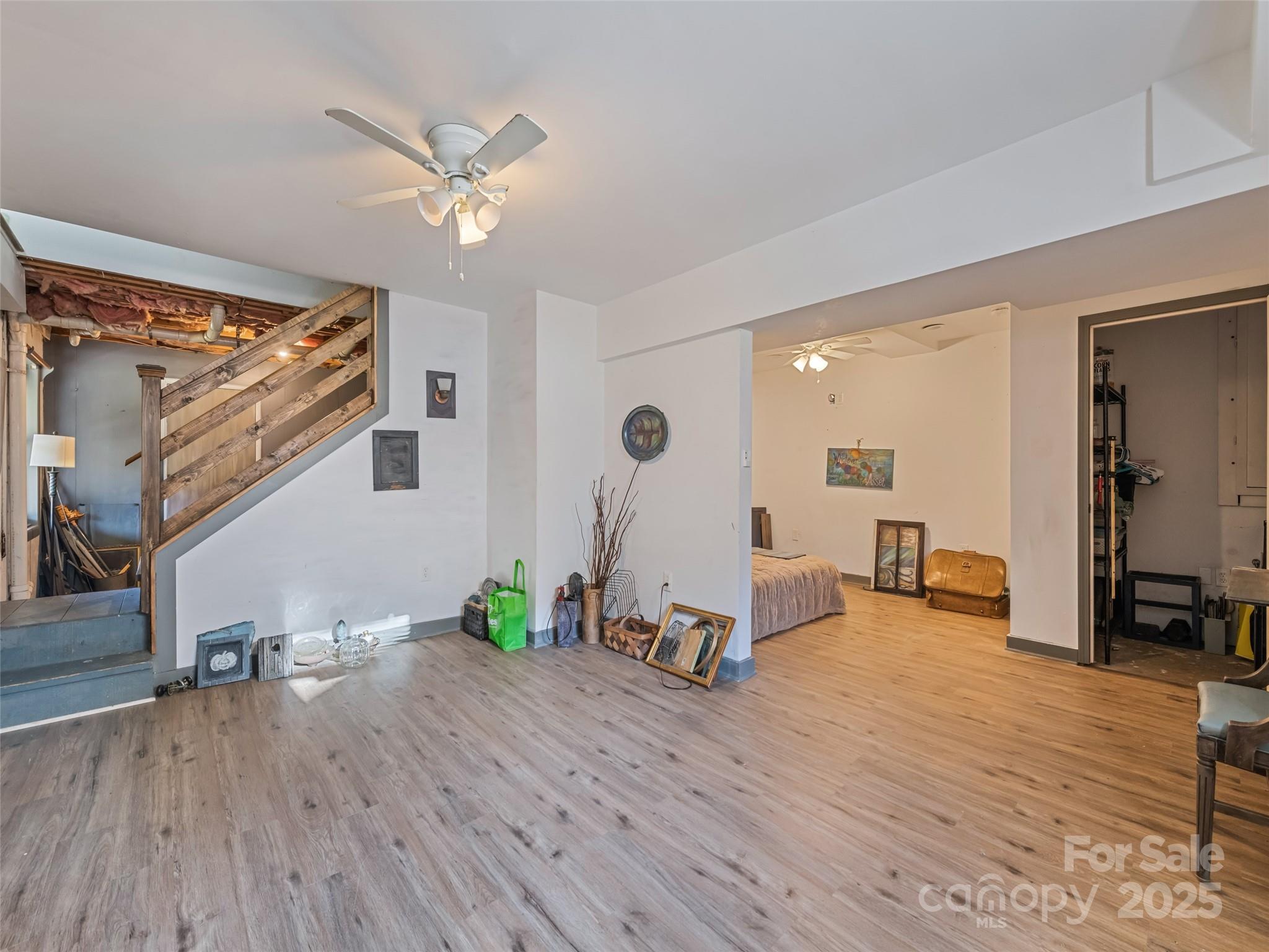 140 Oakdale Road Waynesville, NC 28786 - Photo 23 of 30 a view of a room with wooden floor and furniture
