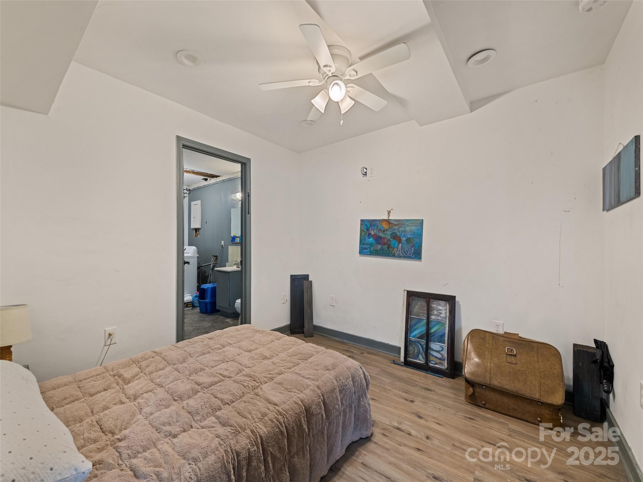 140 Oakdale Road Waynesville, NC 28786 - Photo 26 of 30 a bedroom with a bed and a couch