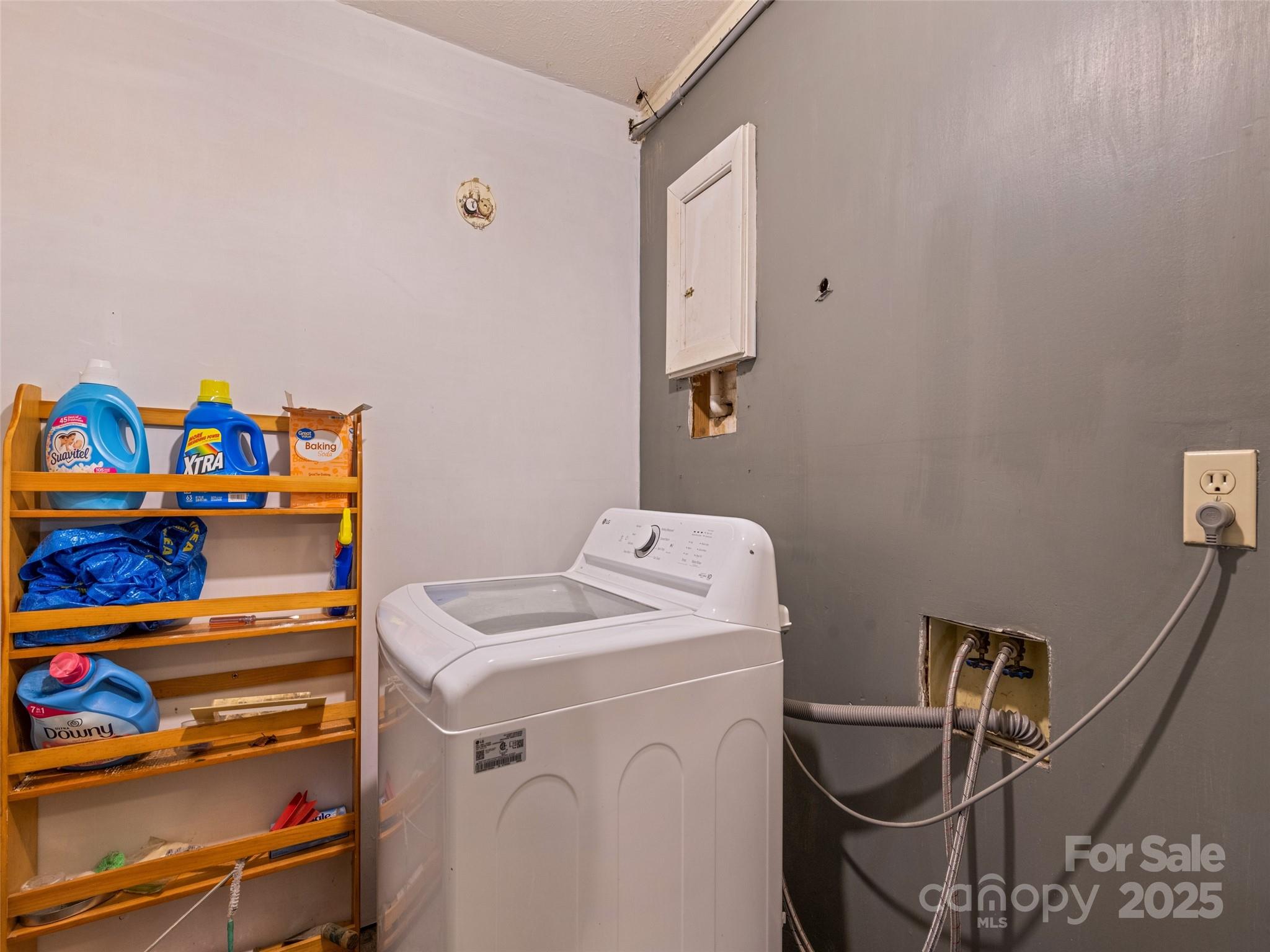 140 Oakdale Road Waynesville, NC 28786 - Photo 28 of 30 a utility room with dryer and washer