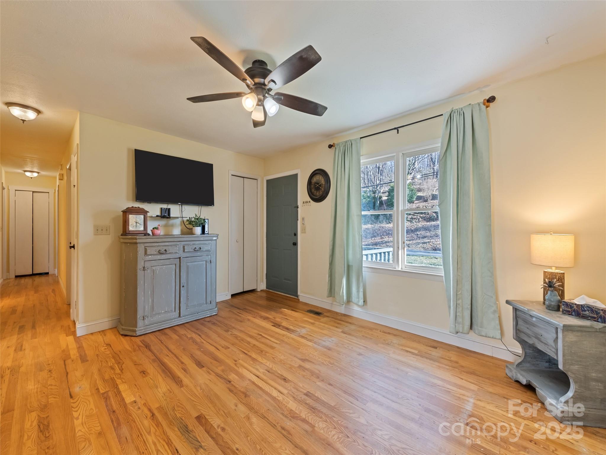 140 Oakdale Road Waynesville, NC 28786 - Photo 9 of 30 a view of a livingroom with a flat screen tv