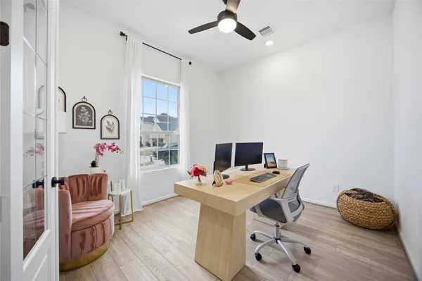 a workspace with furniture and window