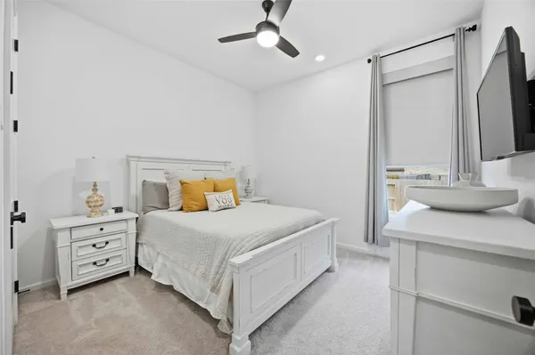 a bedroom with a bed and a dresser