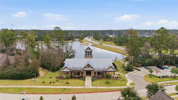 an aerial view of house with yard swimming pool and outdoor seating