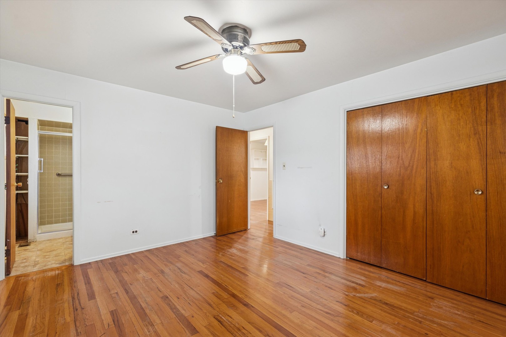 405 West Newport Road Hoffman Estates, IL 60169 - Photo 16 of 28 a view of an empty room with wooden floor