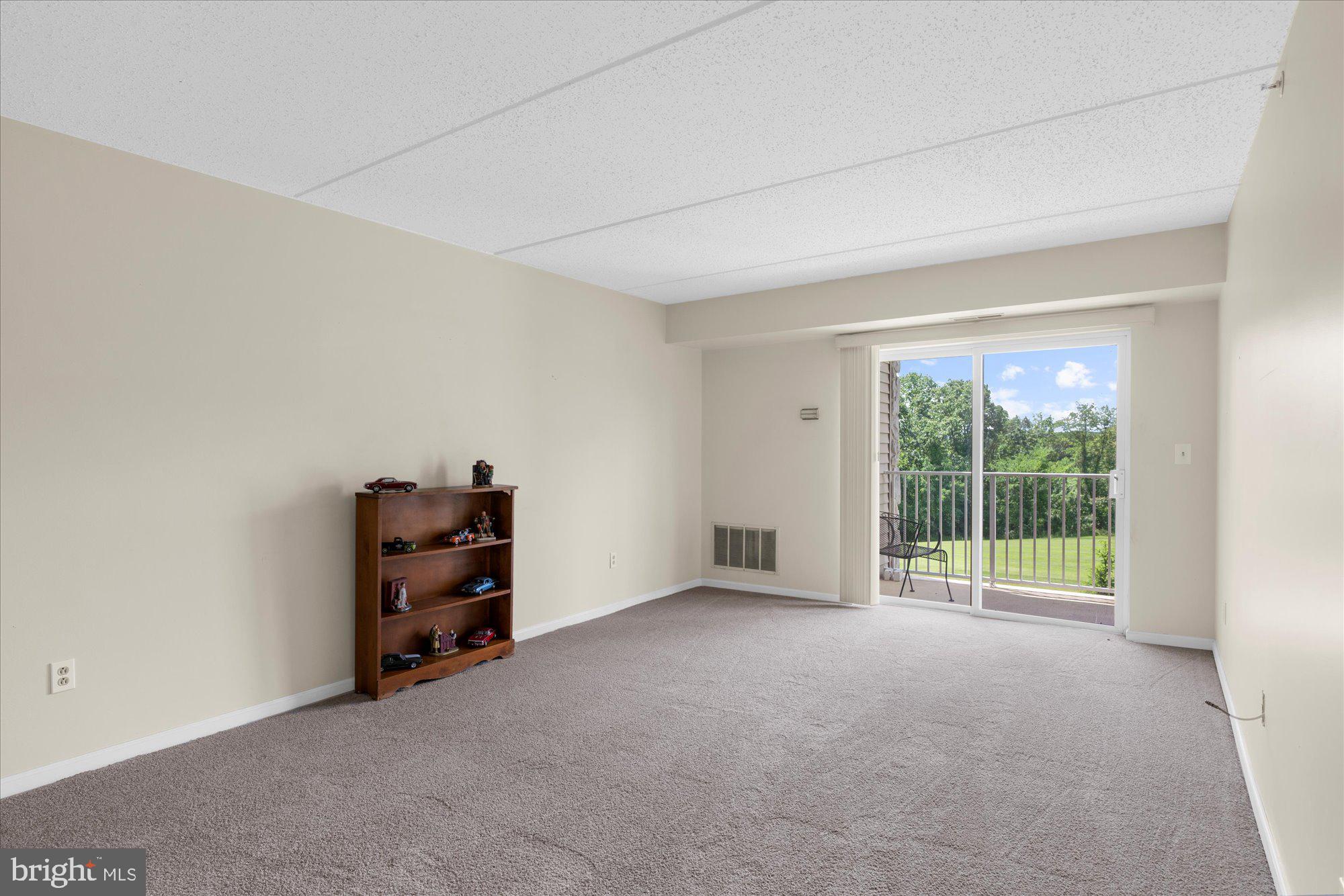 112 Brandon Road Eagleville, PA 19403 - Photo 11 of 19 wooden floor in an empty room with a window