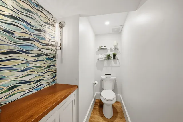 a bathroom with a tub shower and a sink