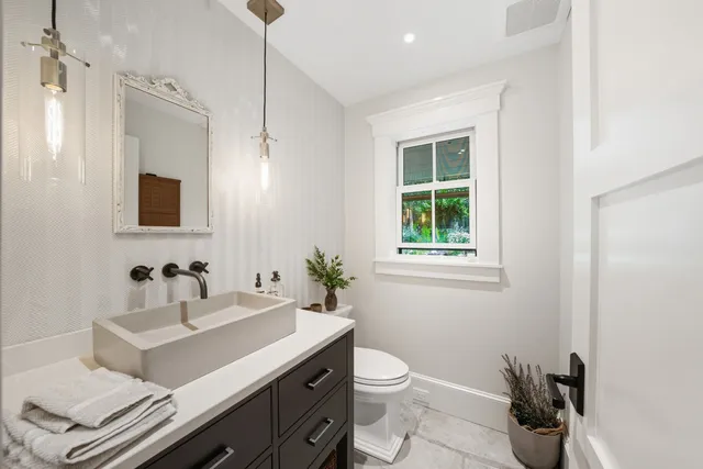 a bed room with a bed and a lamp