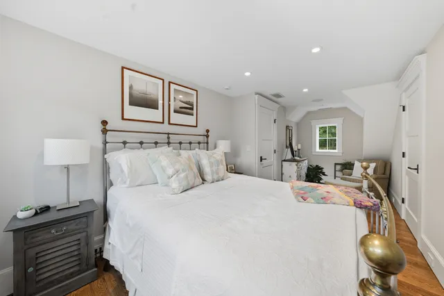 a room with a bed and a large window