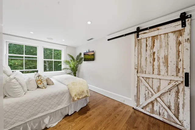 a bed room with a bed and a window