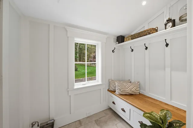 a bathroom with a window and a shower