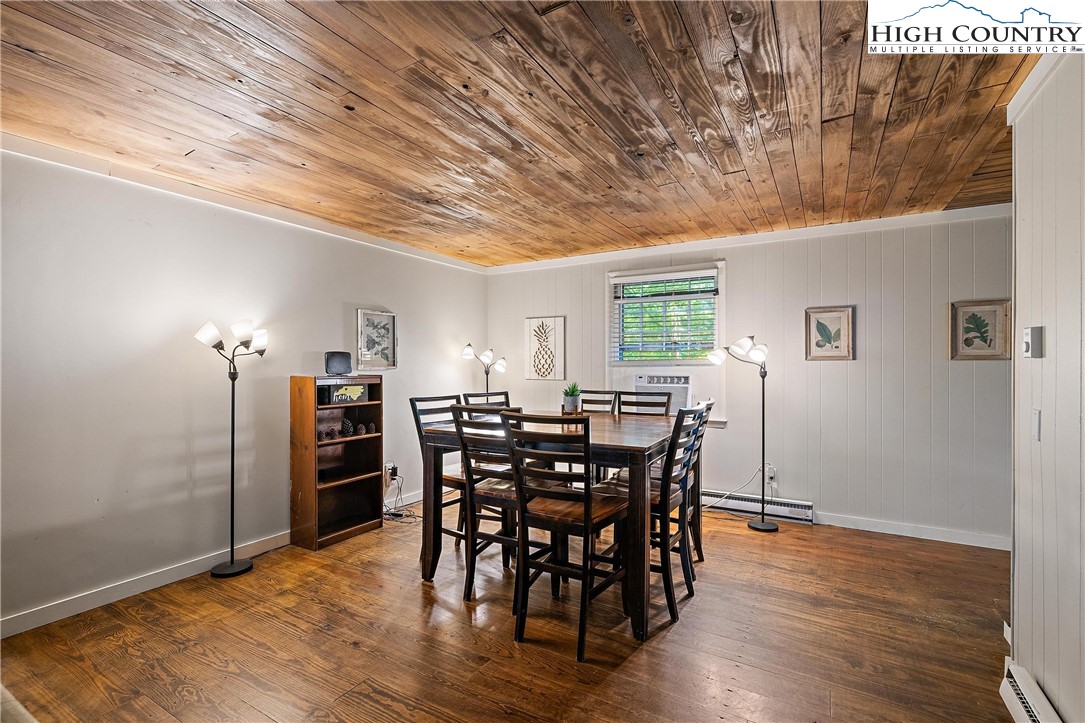 132 Sassafras Deep Gap, NC 28618 - Photo 11 of 33 a view of a dining room with furniture and wooden floor